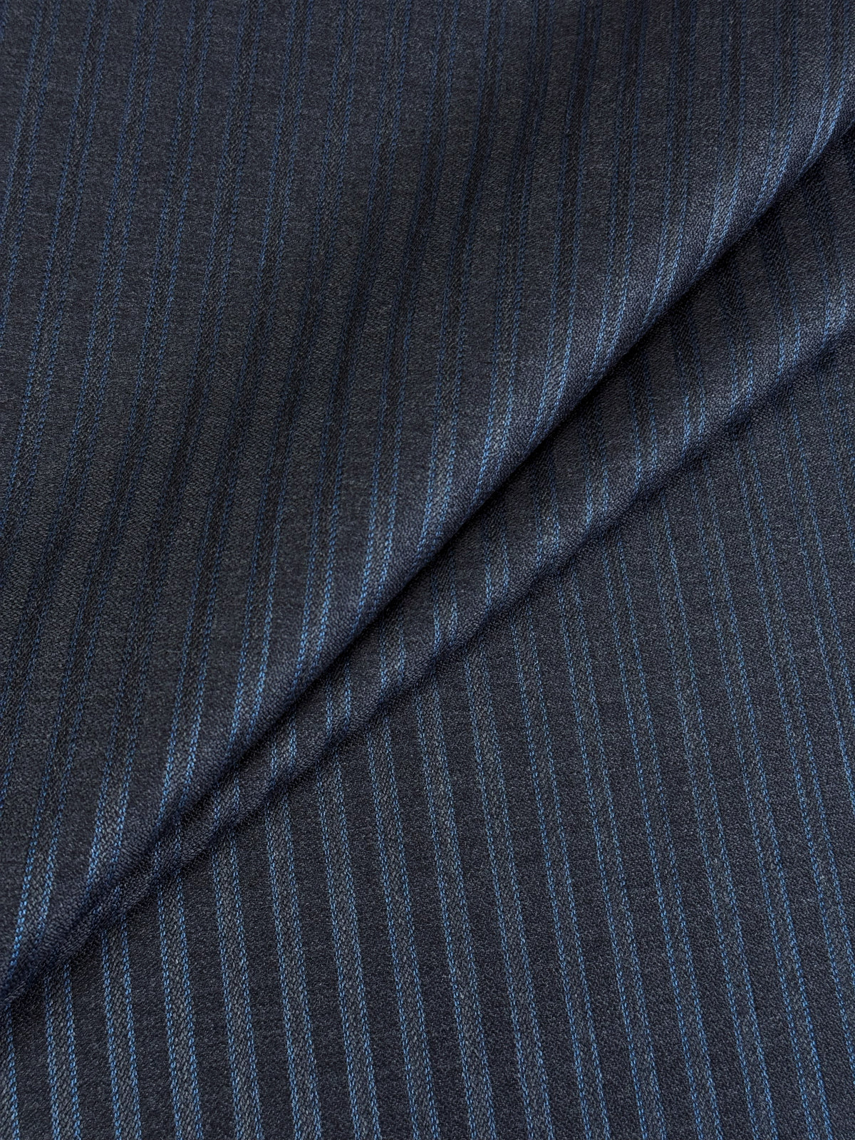 Charcoal wool and cashmere suiting fabric with turquoise double pinstripes, woven in Belgium by Scabal