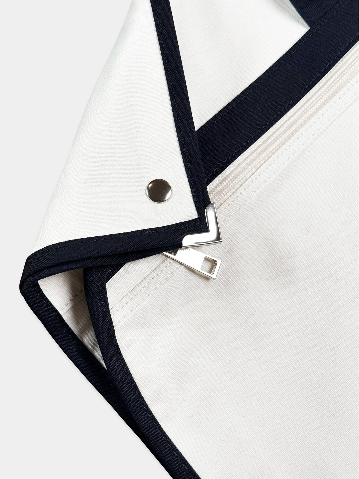 THE BUREAU COTTON GARMENT BAG IN IVORY AND JET BLACK