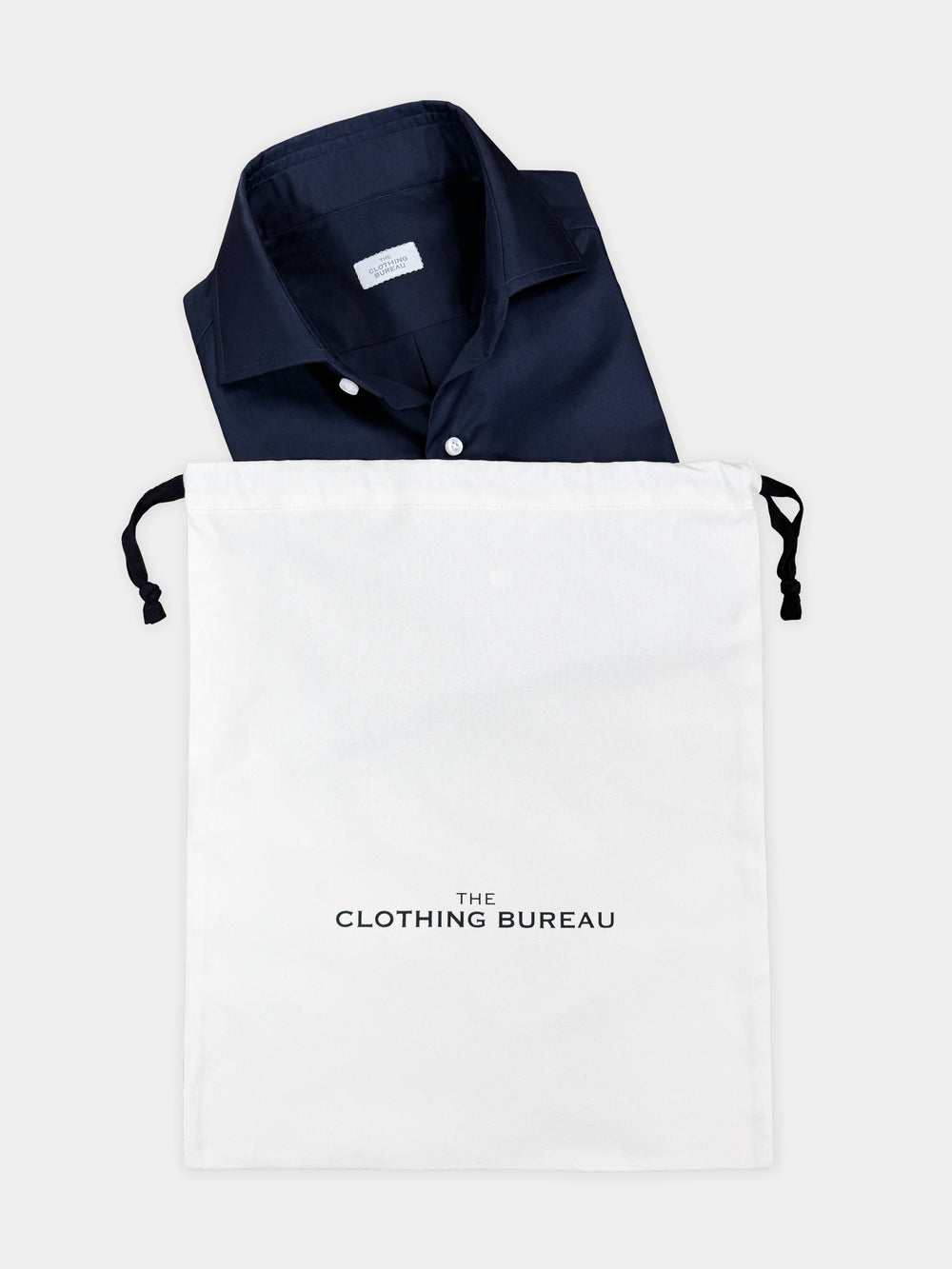 The Clothing Bureau cotton garment bag with a folded shirt
